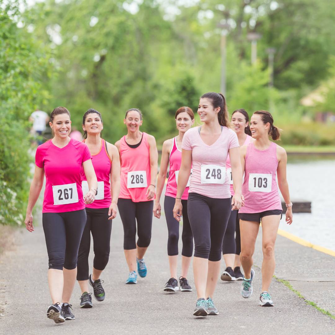 Group of walkers with numbers on them for a charity event