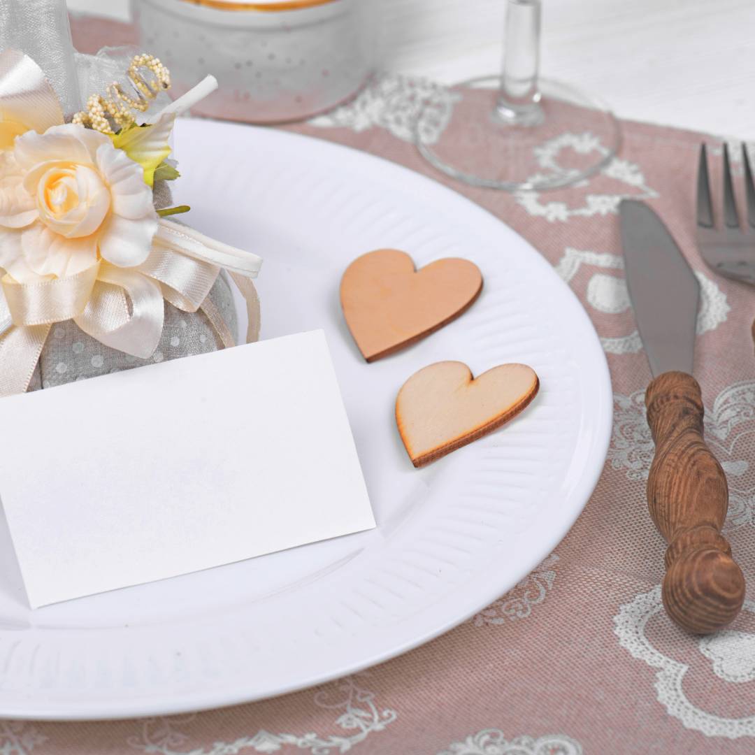 A place setting example for a wedding reception with 2 pink hearts