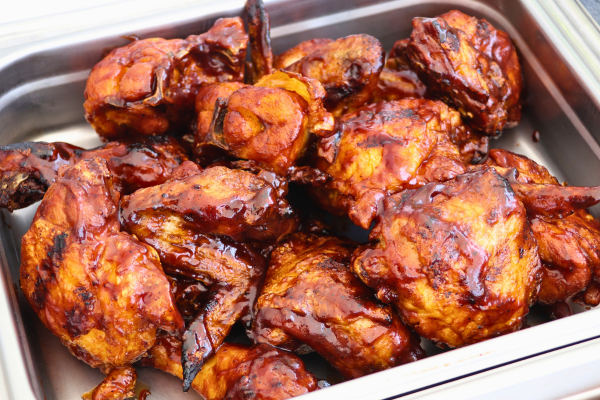 Perfectly grilled chicken pieces slathered in rich barbecue sauce