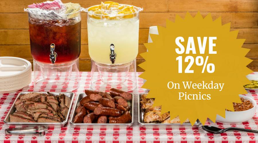 Picnic buffet with lemonade, iced tea and grilled meats