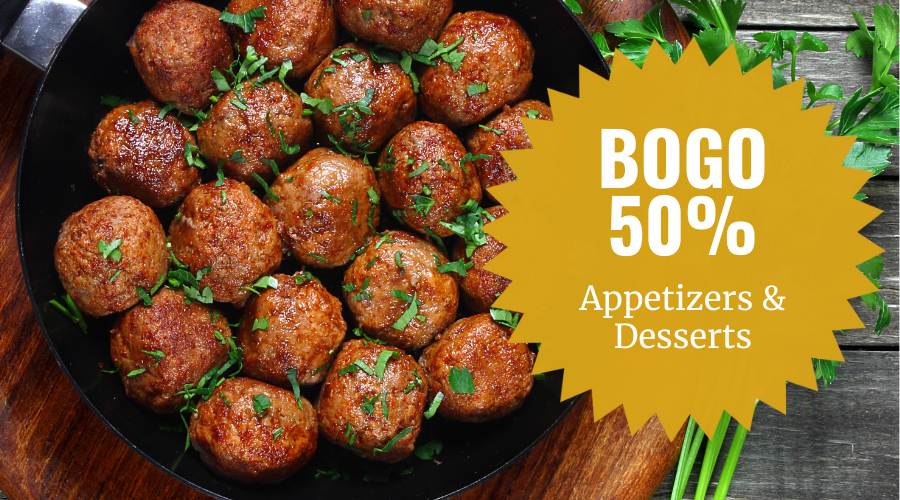 Saucy appetizer meatballs in a hot skillet