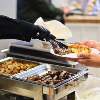 Made to order omelette served with sausage links by professional catering stafff