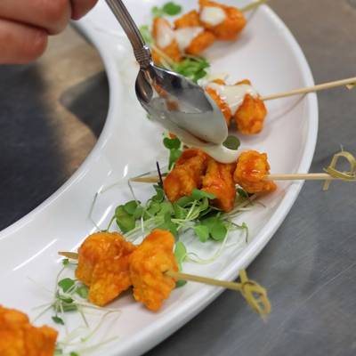 Tasty tangy chicken bite appetizers with a creamy sauce