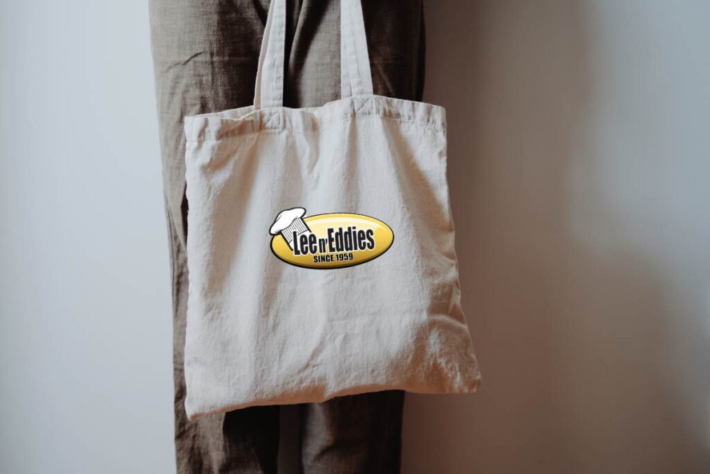 tote bag with a lee n' eddies logo branded on the front