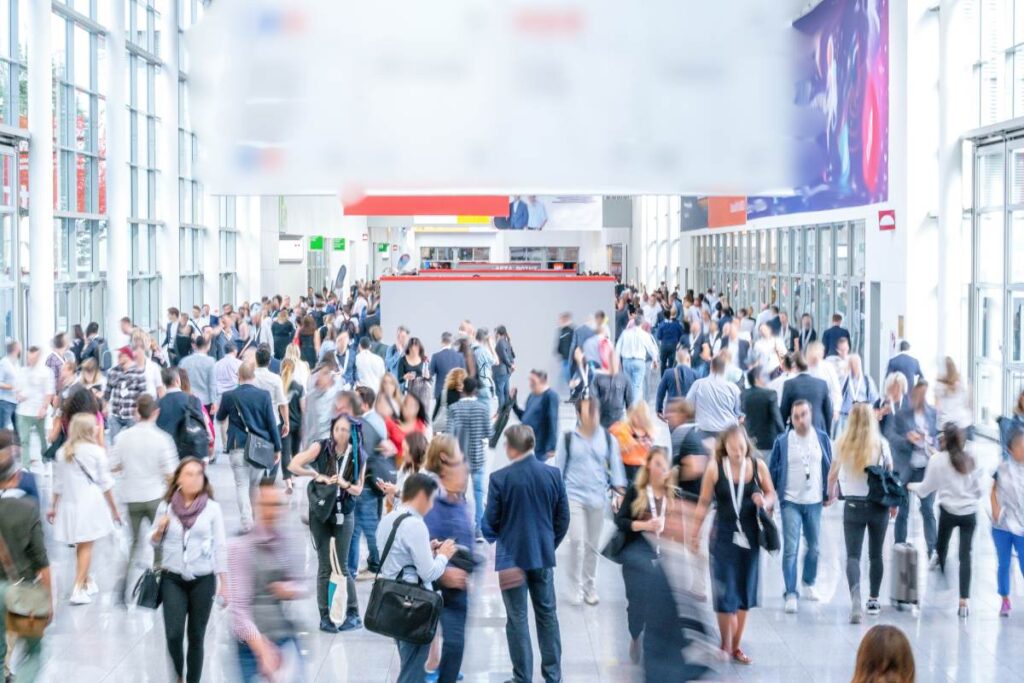 a conference center filled with attendees at an expo