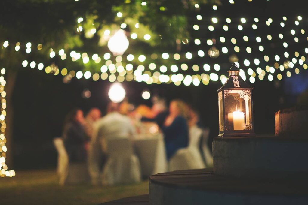 festive string lights glowing at a reception