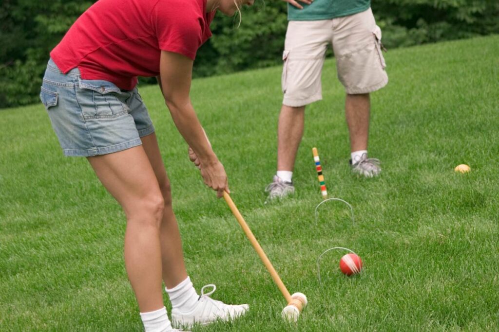 Playing croquet at a summer bbq