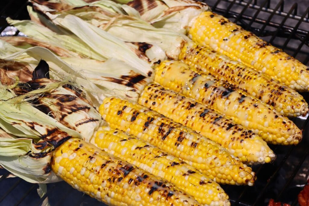 Buttery grilled corn on a grill